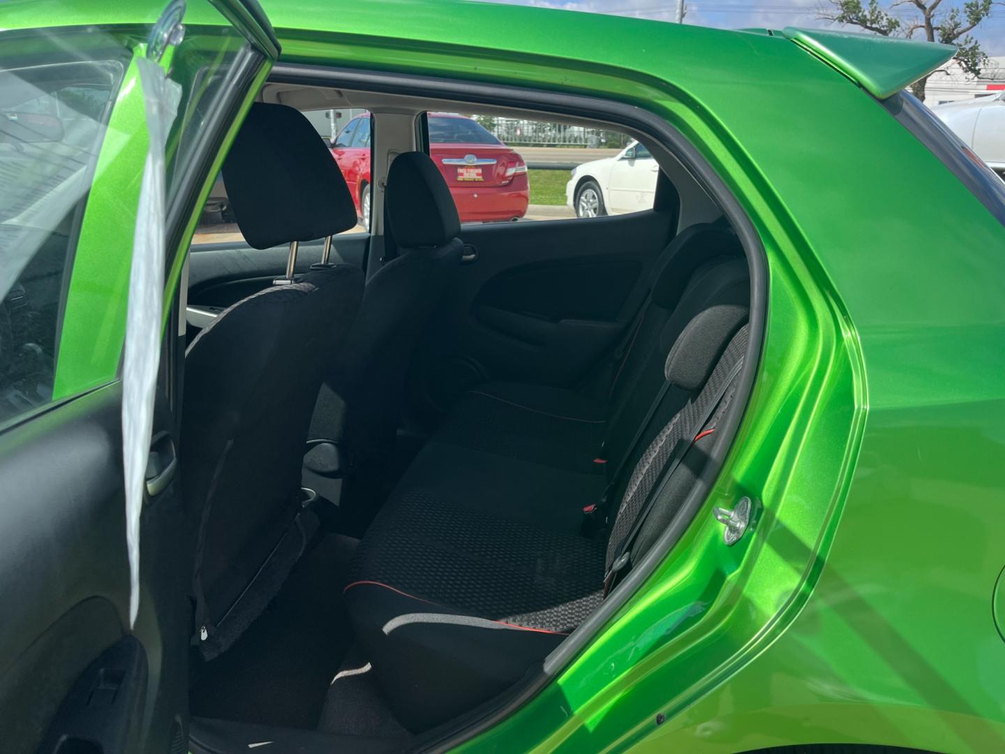 2013 green /black Mazda MAZDA2 Touring (JM1DE1LY1D0) with an 1.5L L4 DOHC 16V engine, Automatic transmission, located at 14700 Tomball Parkway 249, Houston, TX, 77086, (281) 444-2200, 29.928619, -95.504074 - Photo#9